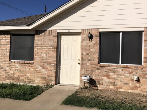 Brick apartment building, unit A entrance.