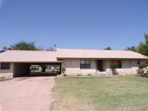 Ranch style house with carport.
