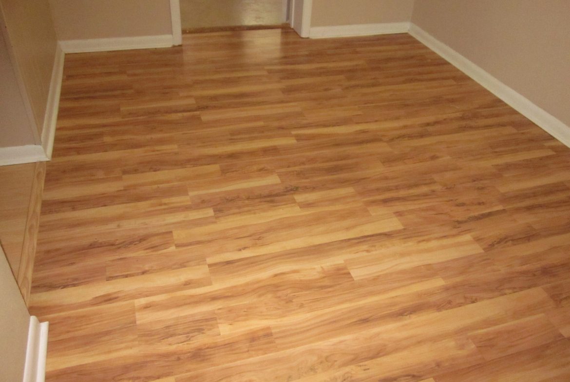 Light brown laminate wood flooring.