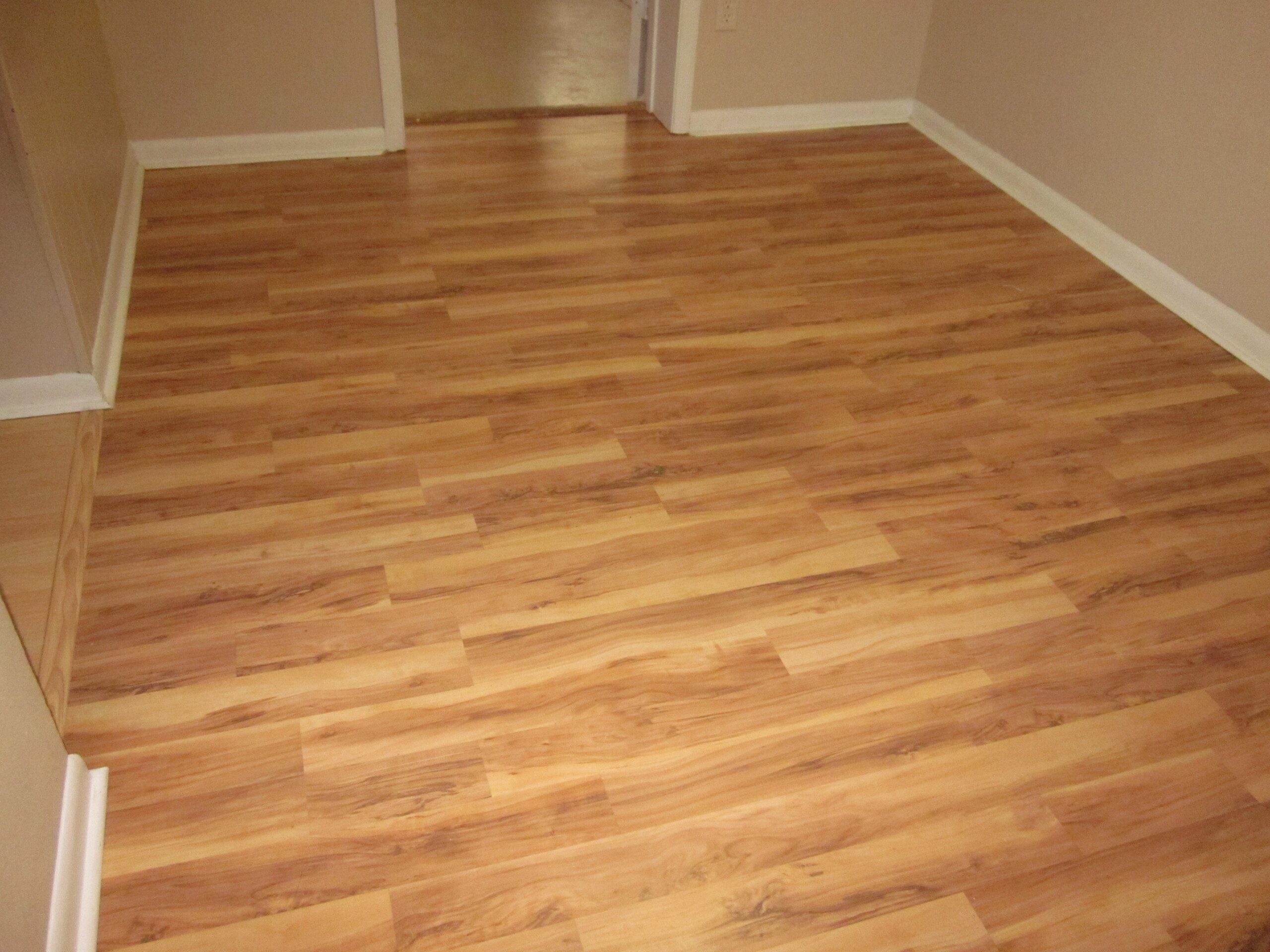 Light brown laminate wood flooring.