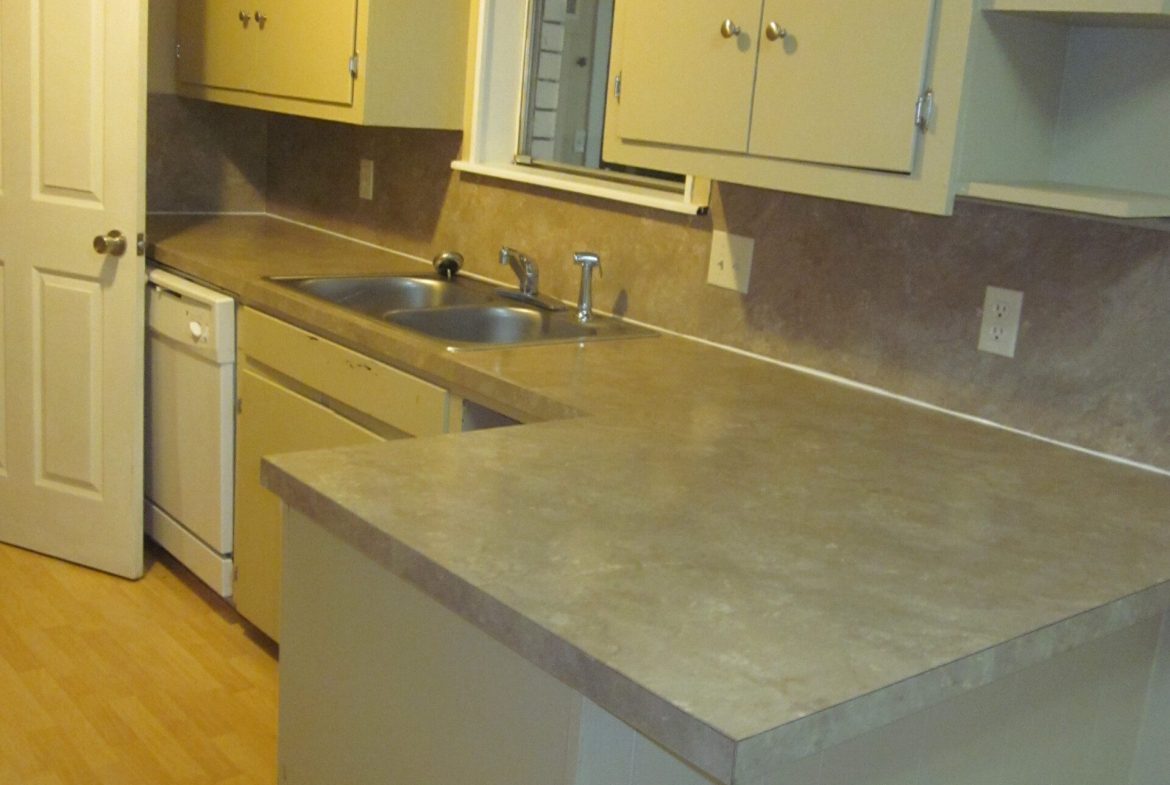 Kitchen with beige cabinets and countertops.