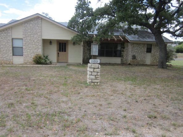 House number 1103, stone facade.