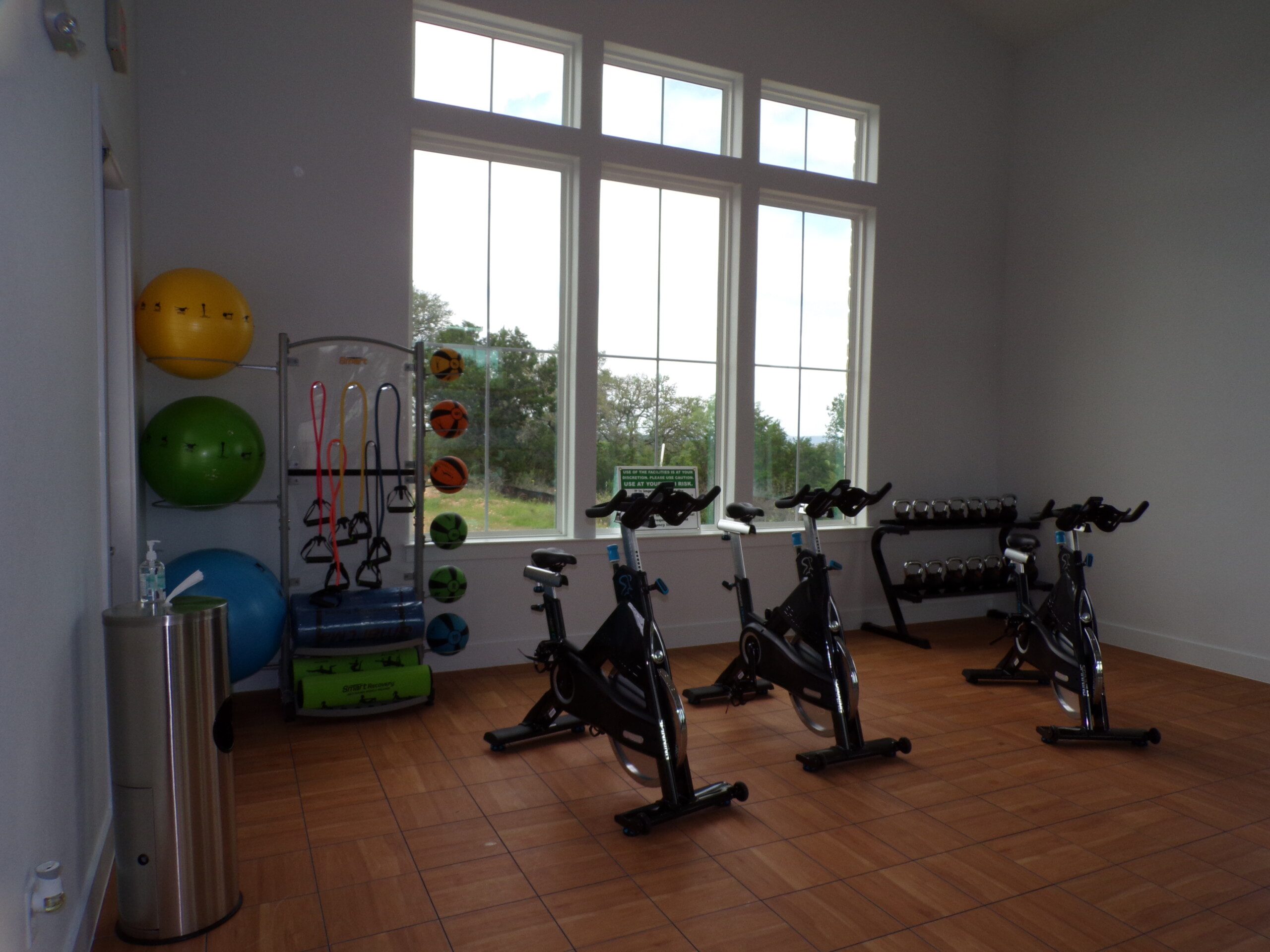 Indoor cycling studio with fitness equipment.