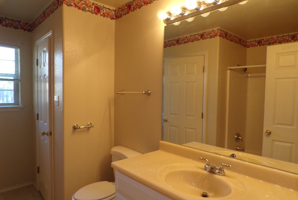 Small bathroom with sink and toilet.