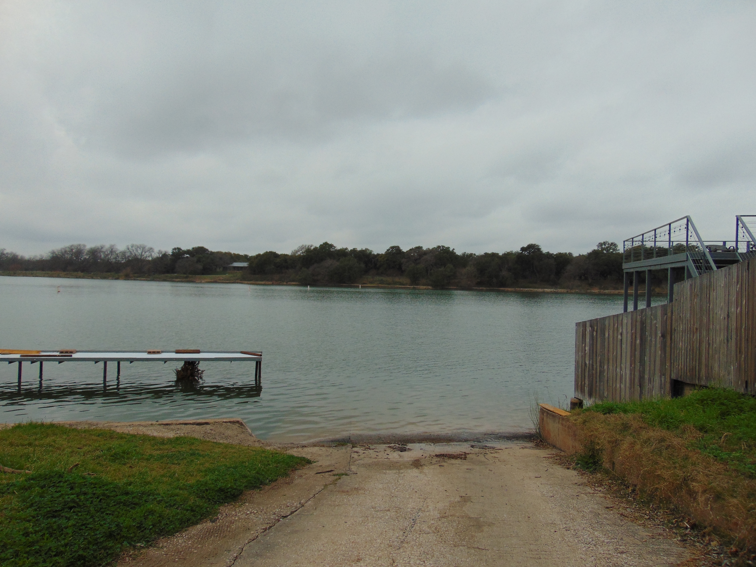 Here's an alt tag for the image: Boat ramp and dock at lake.