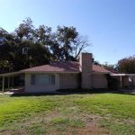 Ranch-style house with covered patio.