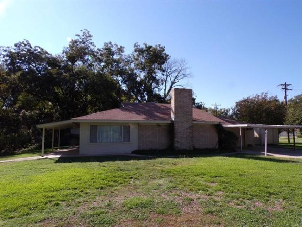 Ranch-style house with covered patio.