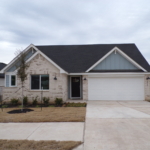 New brick house with attached garage.