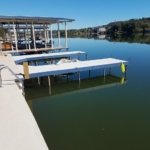 Lake dock with boat lift and swim ladder.
